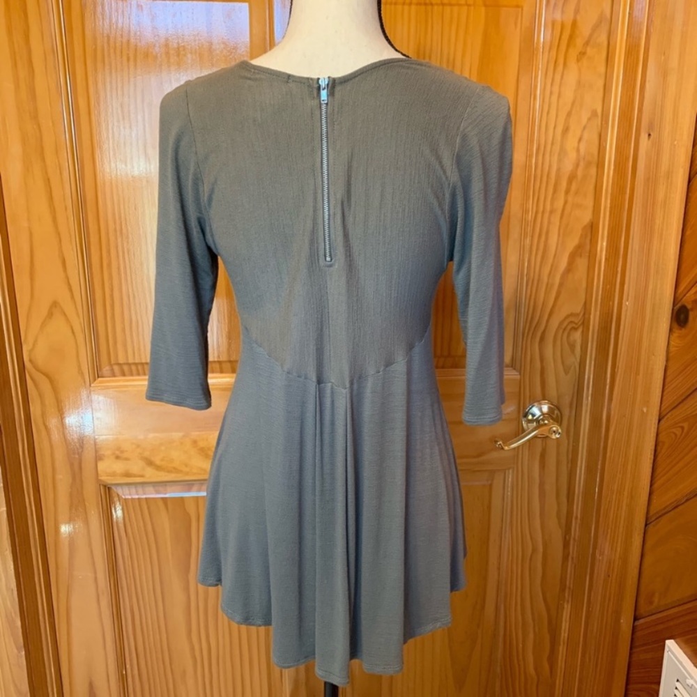 Olive green peplum top with zipper back